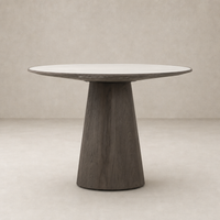 Romina Round Dining Table with white marble top and tapered wood base.