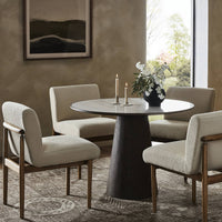 Romina Round Dining Table featuring a sleek white marble top and modern design.