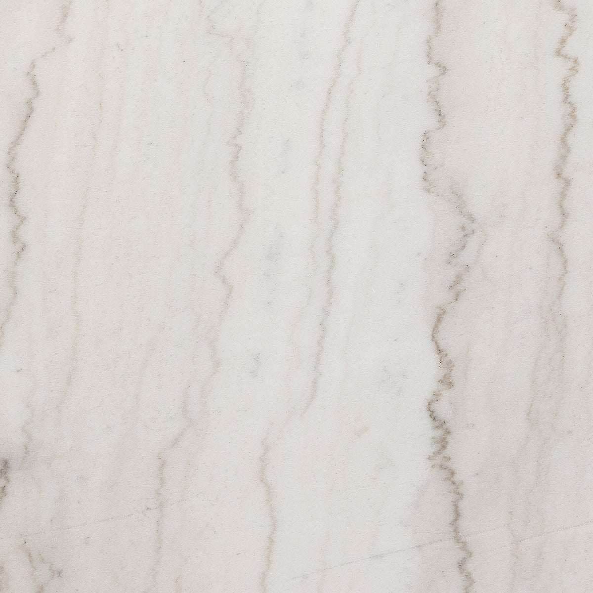 Close-up of the Romina Round Dining Table featuring beautiful white marble texture.