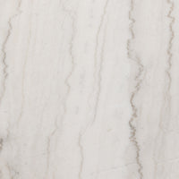 Close-up of the Romina Round Dining Table featuring beautiful white marble texture.