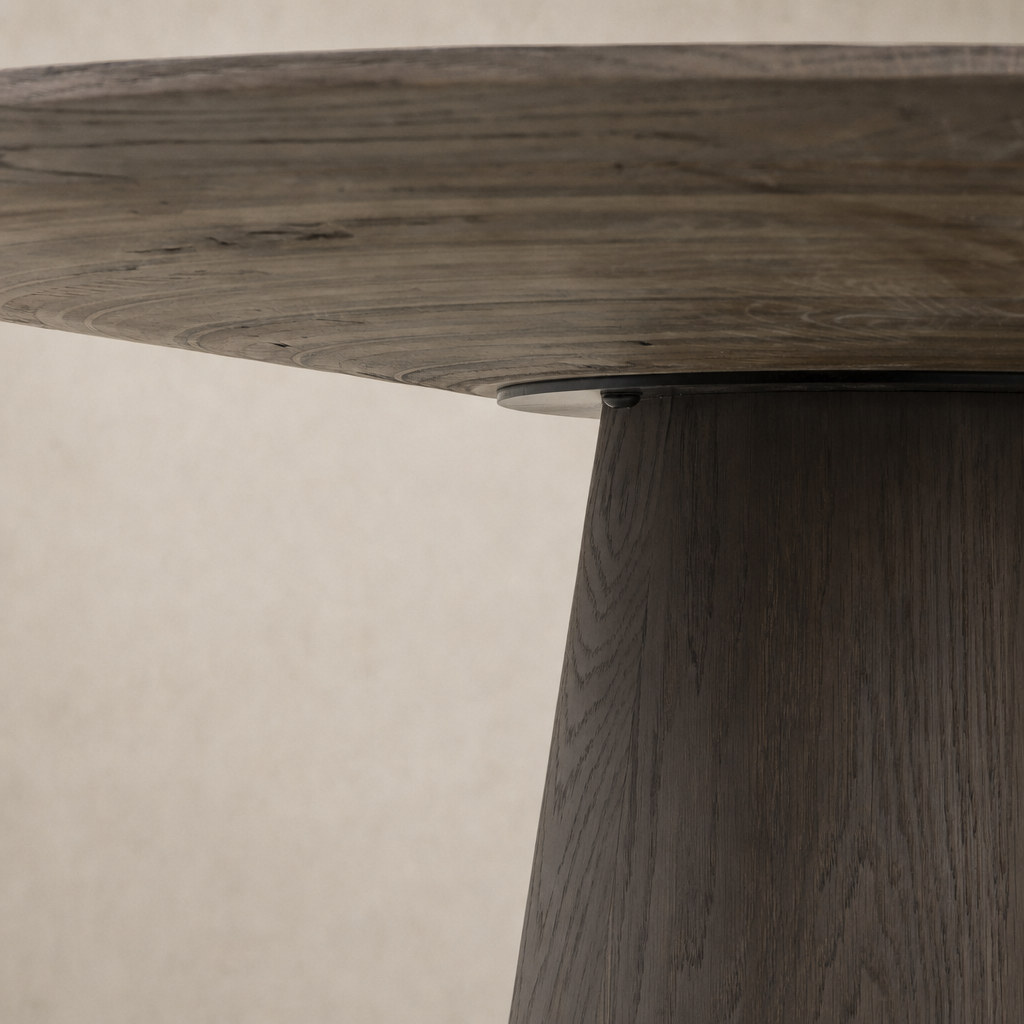 Close-up of the Romina Round Dining Table's smooth white marble top and unique base design.