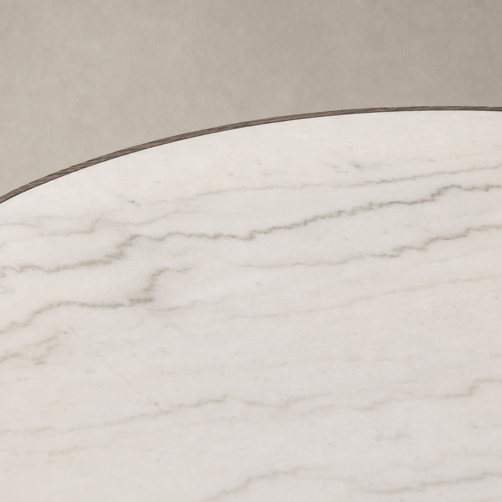 Close-up of the Romina Round Dining Table featuring a sleek white marble surface.