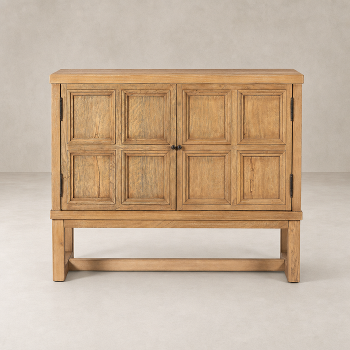 Samara Small Cabinet in Worn Oak featuring a textured paneled design and sturdy base.
