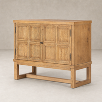 Samara Small Cabinet in worn oak with a classic panel design and sturdy base.