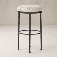 Jasper Bar + Counter Stool in Ivan Stone with textured plush seat and sturdy black base.