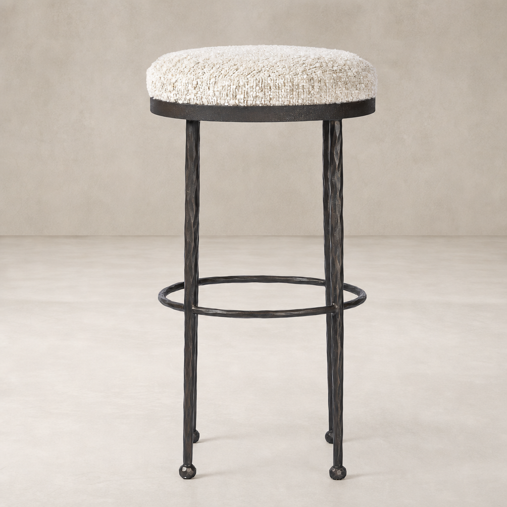Jasper Bar + Counter Stool in Ivan Stone features a plush, round upholstered seat and a sturdy metal frame.