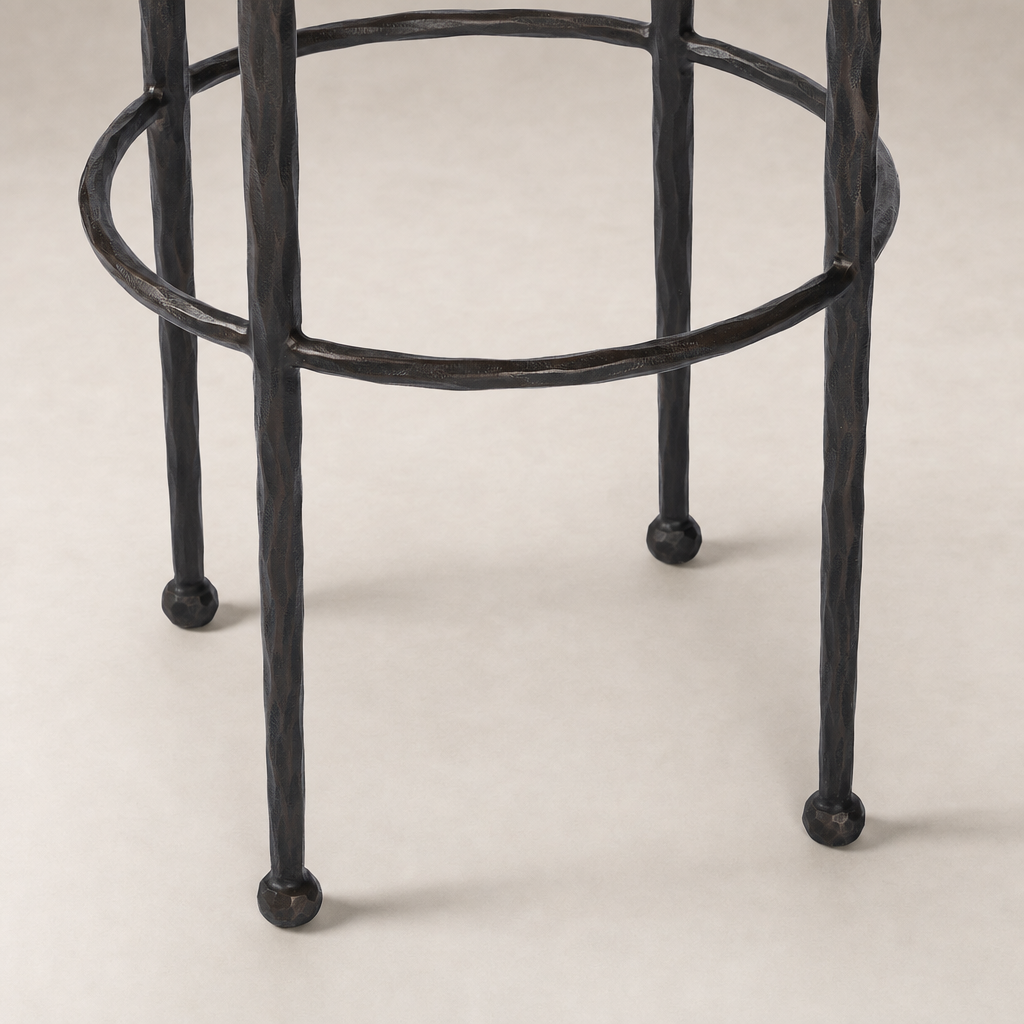 Jasper Bar + Counter Stool in Ivan Stone features textured metal legs with a circular footrest.