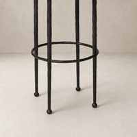 Jasper Bar + Counter Stool features twisted Ivan Stone legs for unique texture.