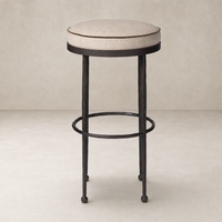 Jasper Bar + Counter Stool in Alcala Taupe with a sleek metal base and plush round seat.