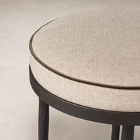 Jasper Bar + Counter Stool in Alcala Taupe features a round upholstered seat with a textured finish.