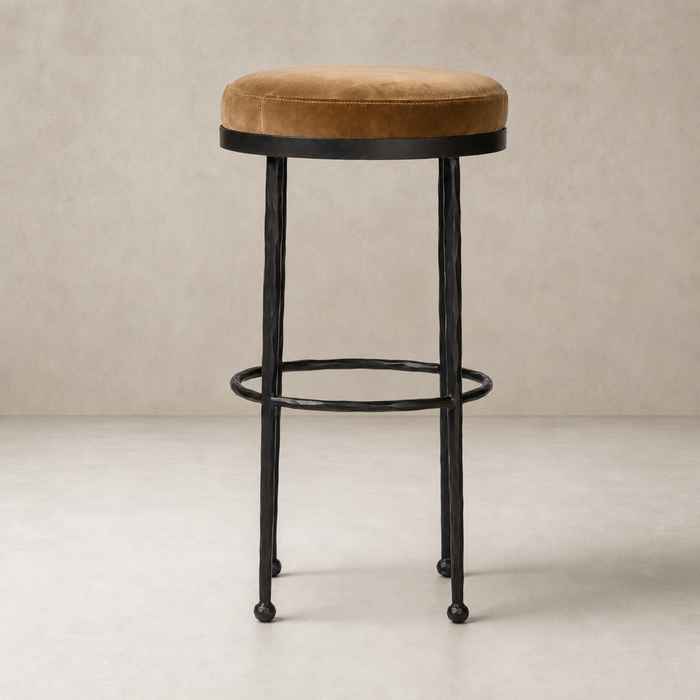 Jasper Bar + Counter Stool in Surrey Ochre with a soft velvet seat and black metal legs.