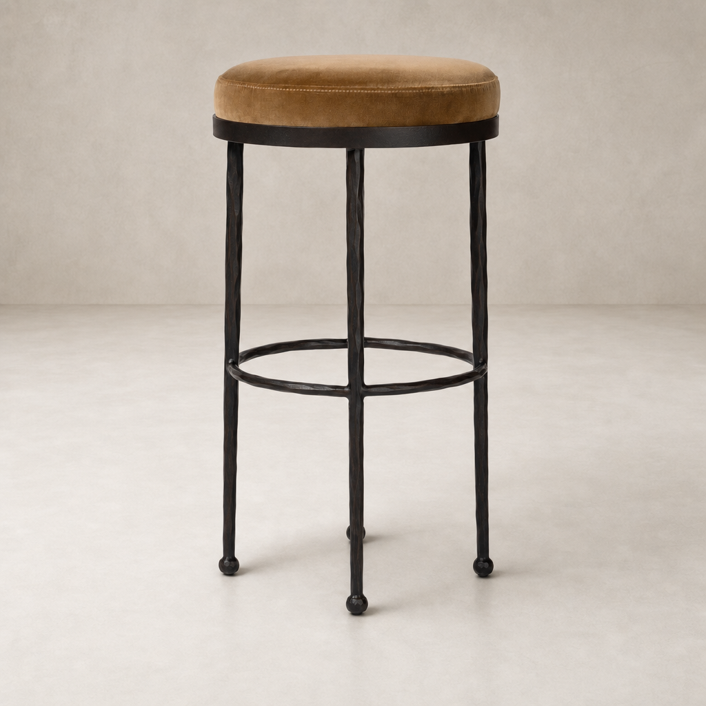 Jasper Bar + Counter Stool in Surrey Ochre with a plush velvet seat and sturdy metal legs.