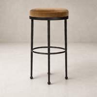 Jasper Bar + Counter Stool in Surrey Ochre with a plush velvet seat and sturdy metal legs.