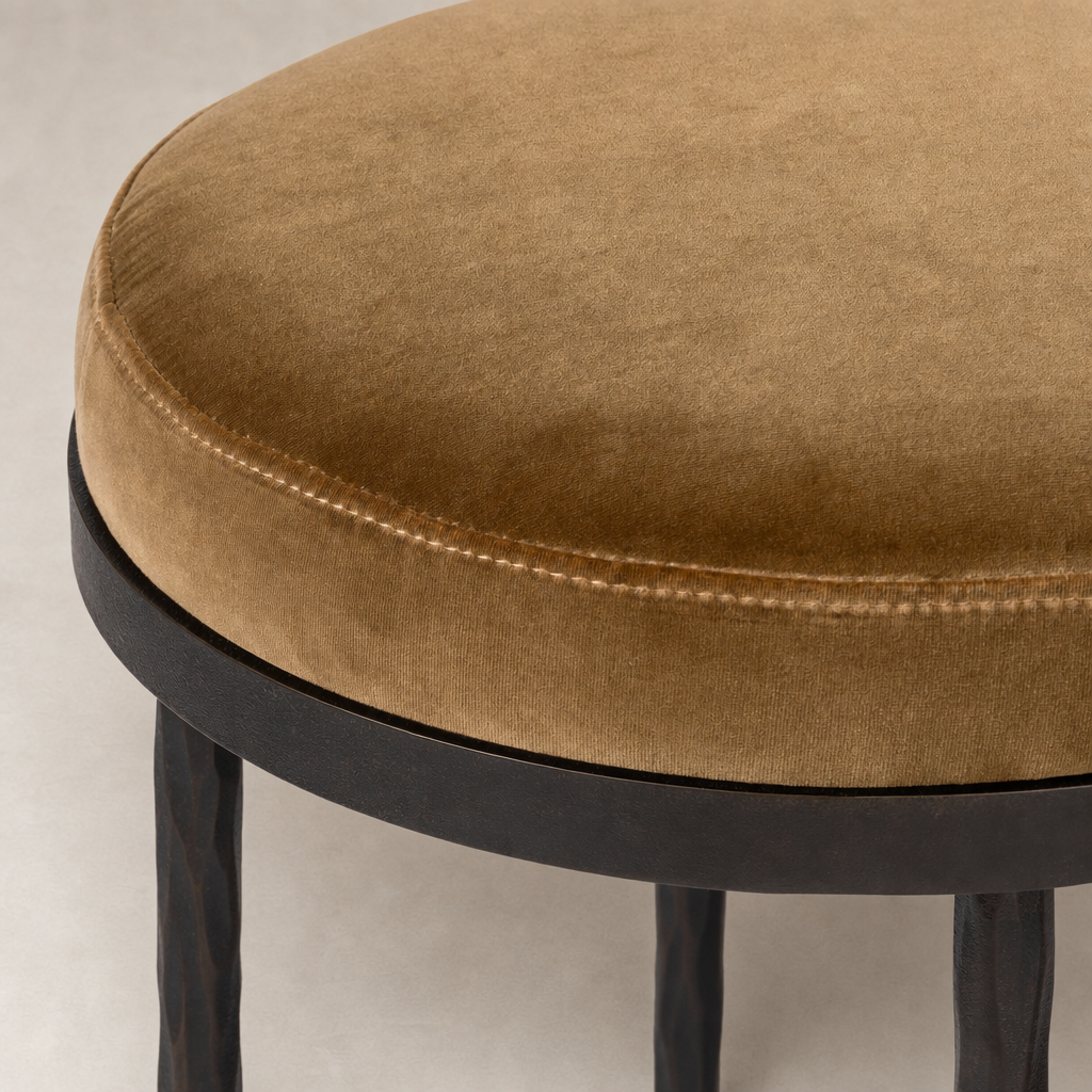 Surrey Ochre Jasper Bar + Counter Stool features a plush, round seat with textured fabric.