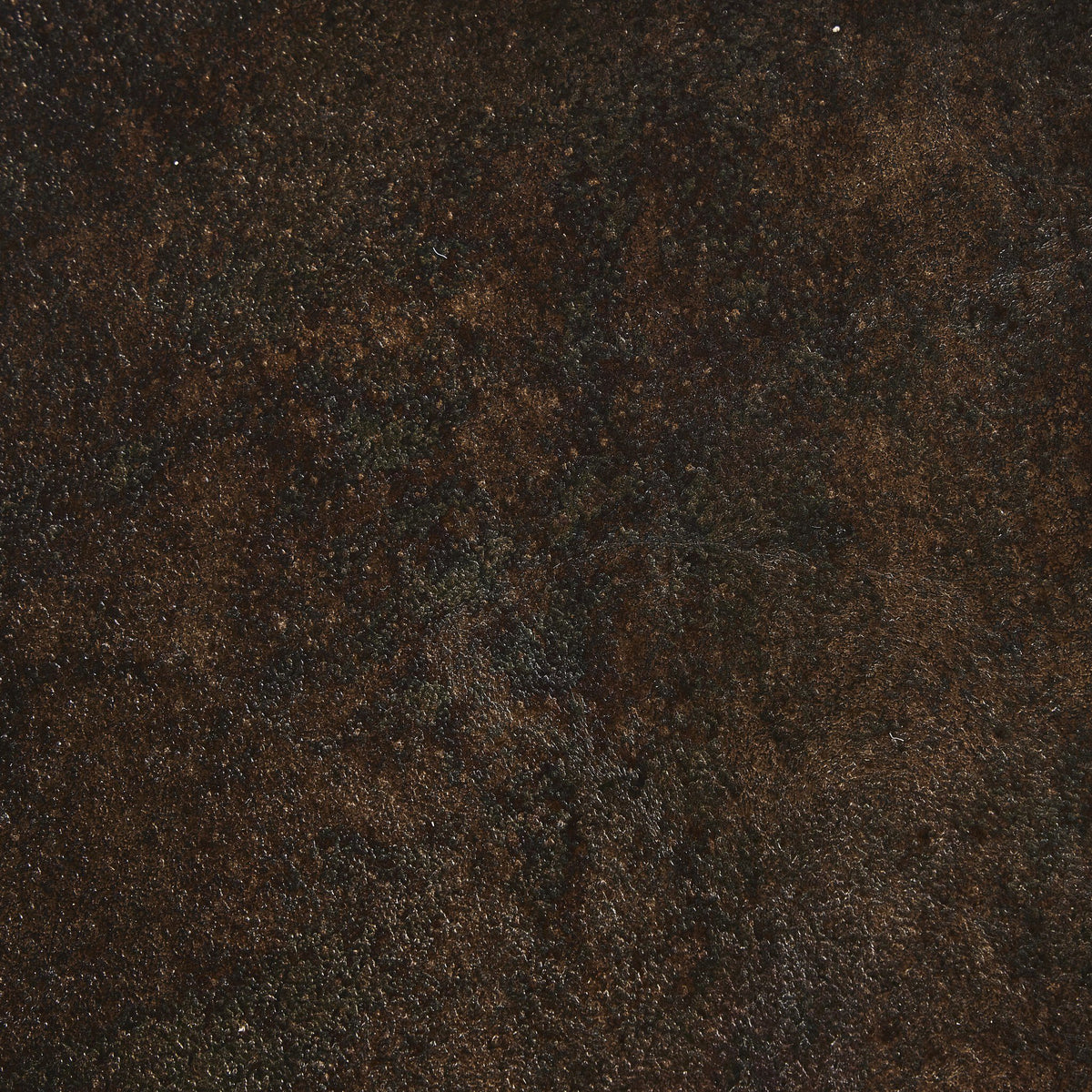 Textured surface of Cade Coffee Table in distressed bronze finish.