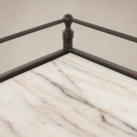 Soren Nightstand featuring a sleek marble top and elegant metal frame.