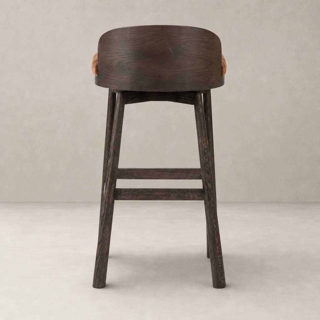 Quito Swivel Bar + Counter Stool in Altair Sienna with a curved wooden back.