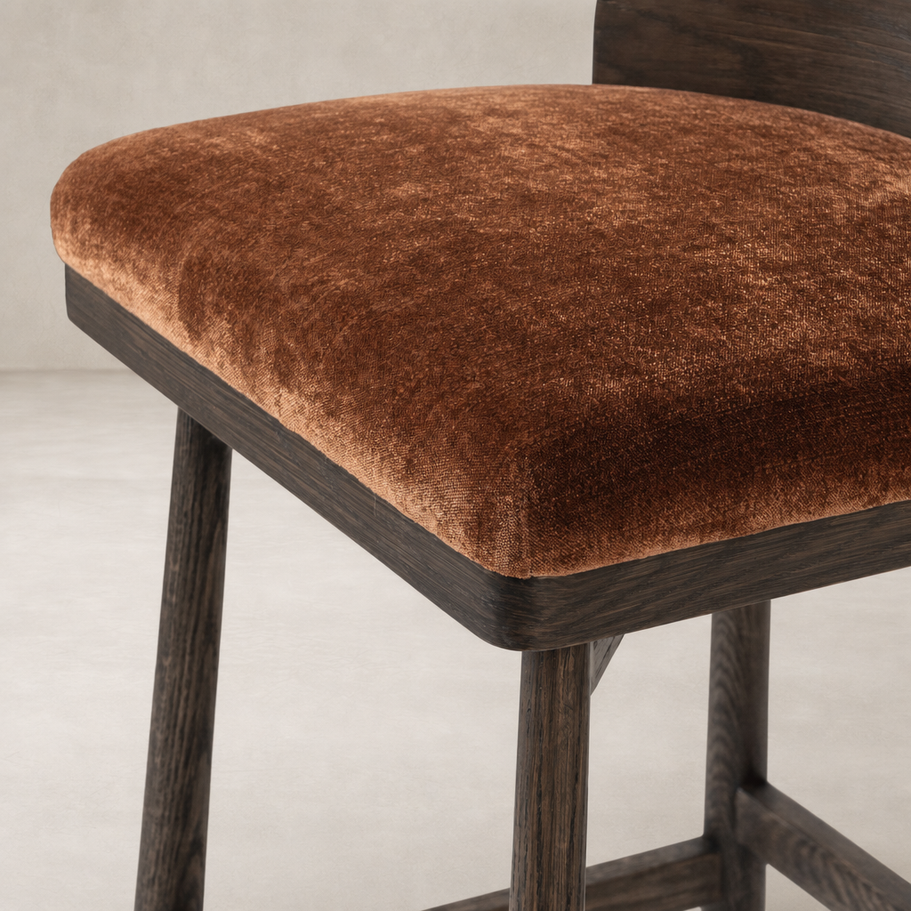 Quito Swivel Bar + Counter Stool in Altair Sienna with plush velvet seat and dark wooden legs.