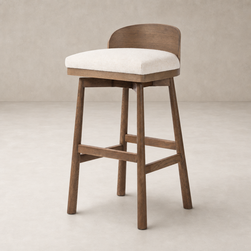 Quito Swivel Bar + Counter Stool in Thames Cream with curved back and wooden legs.