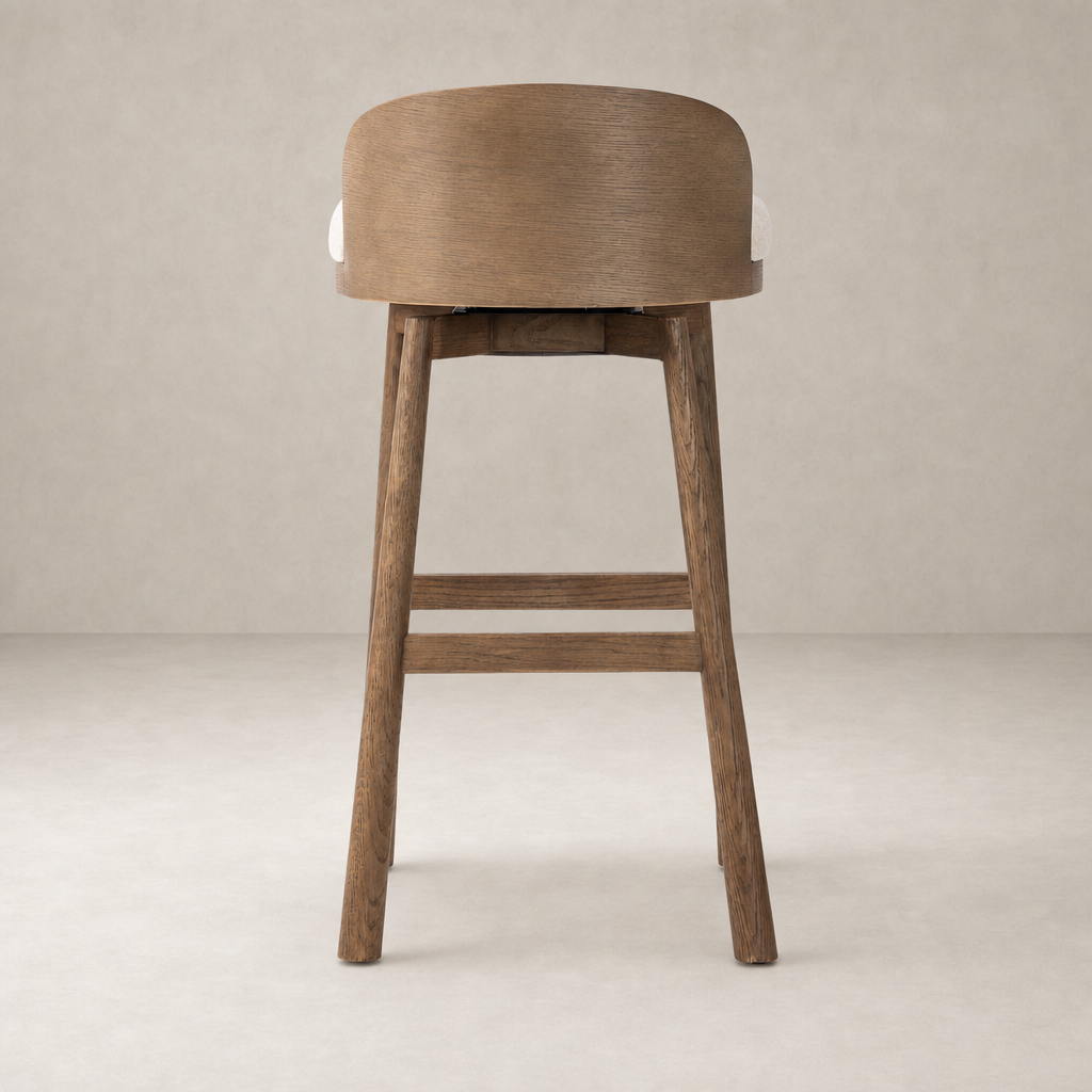 Quito Swivel Bar + Counter Stool in Thames Cream with sleek wooden legs and backrest.