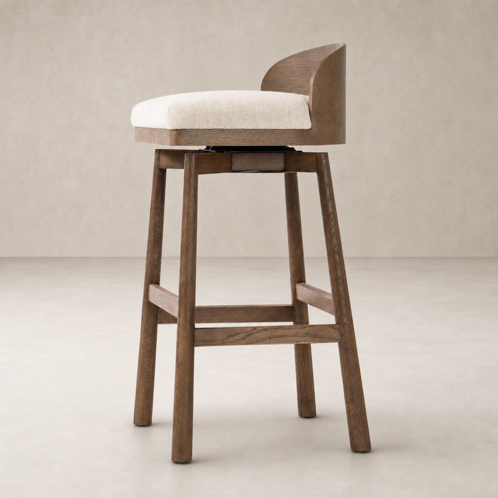 Quito Swivel Bar + Counter Stool in Thames Cream with a modern wood base and plush seat.
