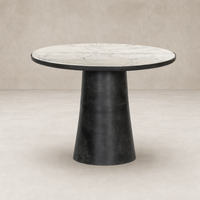 Sloane Outdoor Dining Table features a veined white marble top and sleek black base.