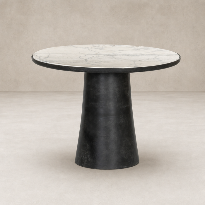 Sloane Outdoor Dining Table features a veined white marble top and sleek black base.