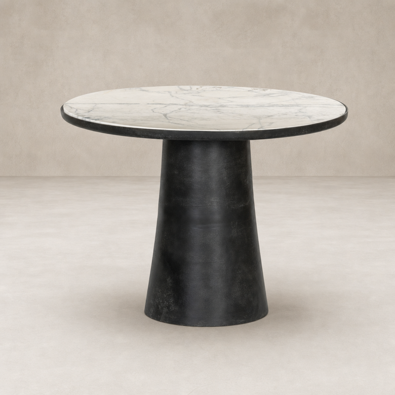 Sloane Outdoor Dining Table features a veined white marble top and sleek black base.