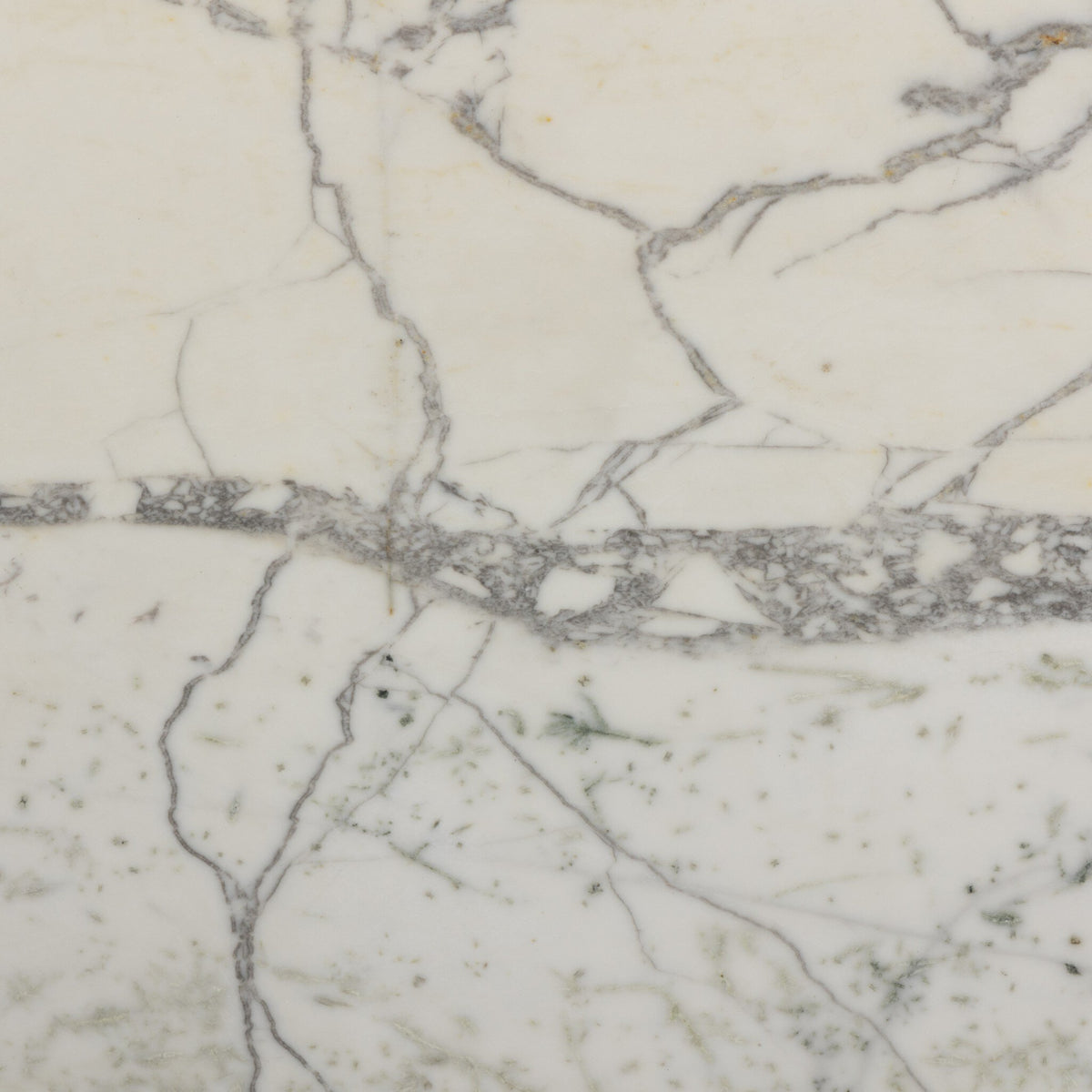 Close-up of veined white marble finish on Sloane Outdoor Dining Table.