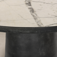 Sloane Outdoor Dining Table featuring a veined white marble top and sturdy black base.
