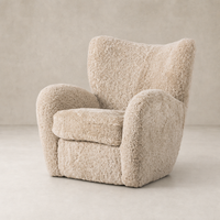 Beige shearling Elodie Chair featuring a plush, rounded design and soft texture.