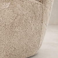 Beige shearling texture of the Elodie Chair showcasing its plush, cozy surface.