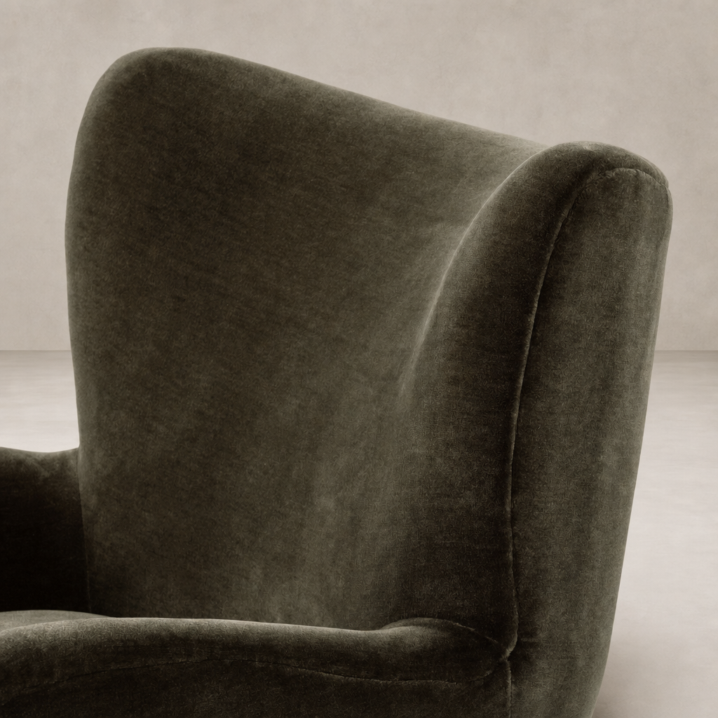 Elodie Chair in Monte Olive with soft velvet upholstery and curved high back design.