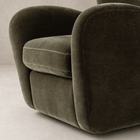Elodie Chair in Monte Olive offers a plush, rounded design with soft velvet upholstery.
