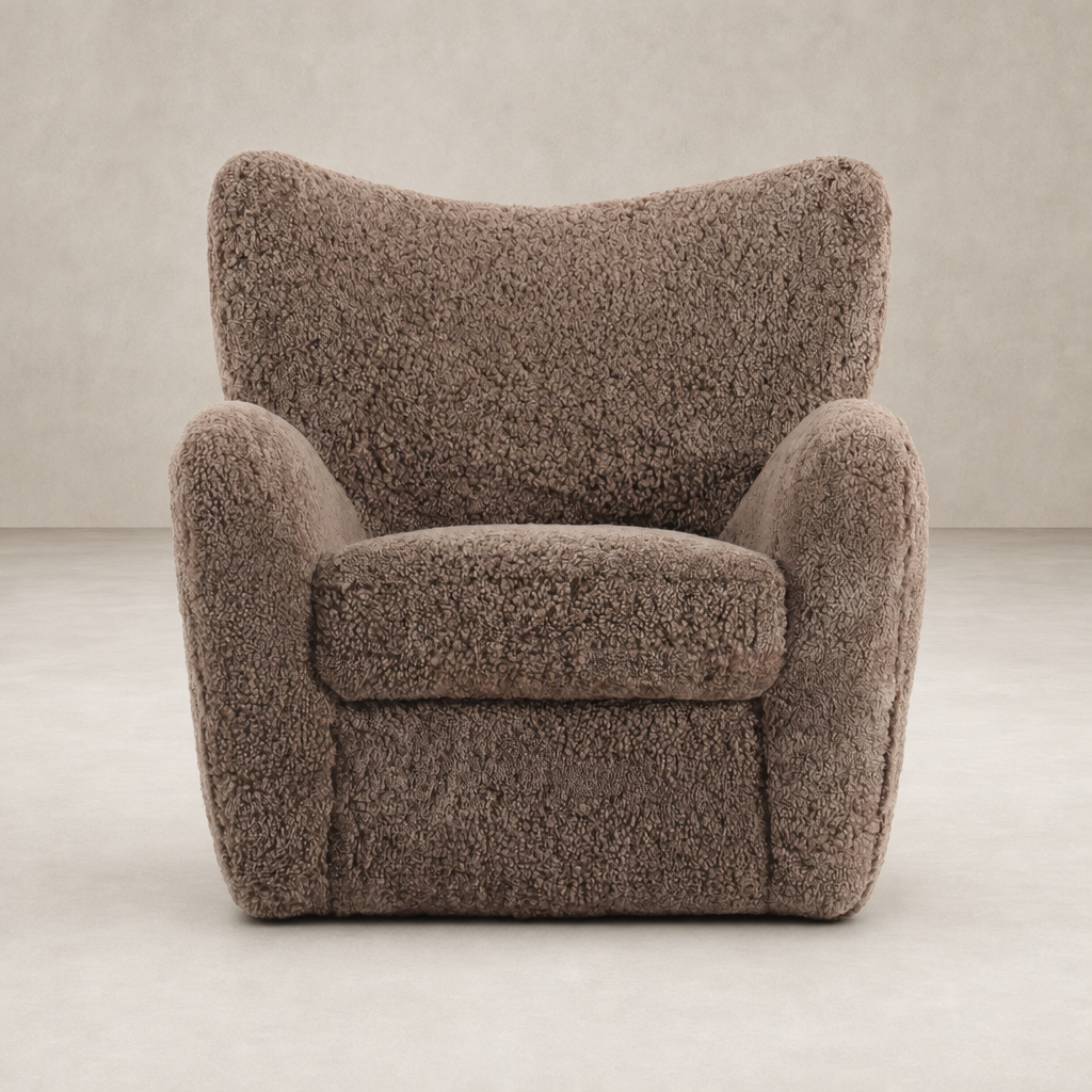 Elodie Chair in taupe shearling with a plush, rounded design and soft texture.