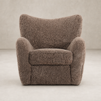 Elodie Chair in taupe shearling with a plush, rounded design and soft texture.