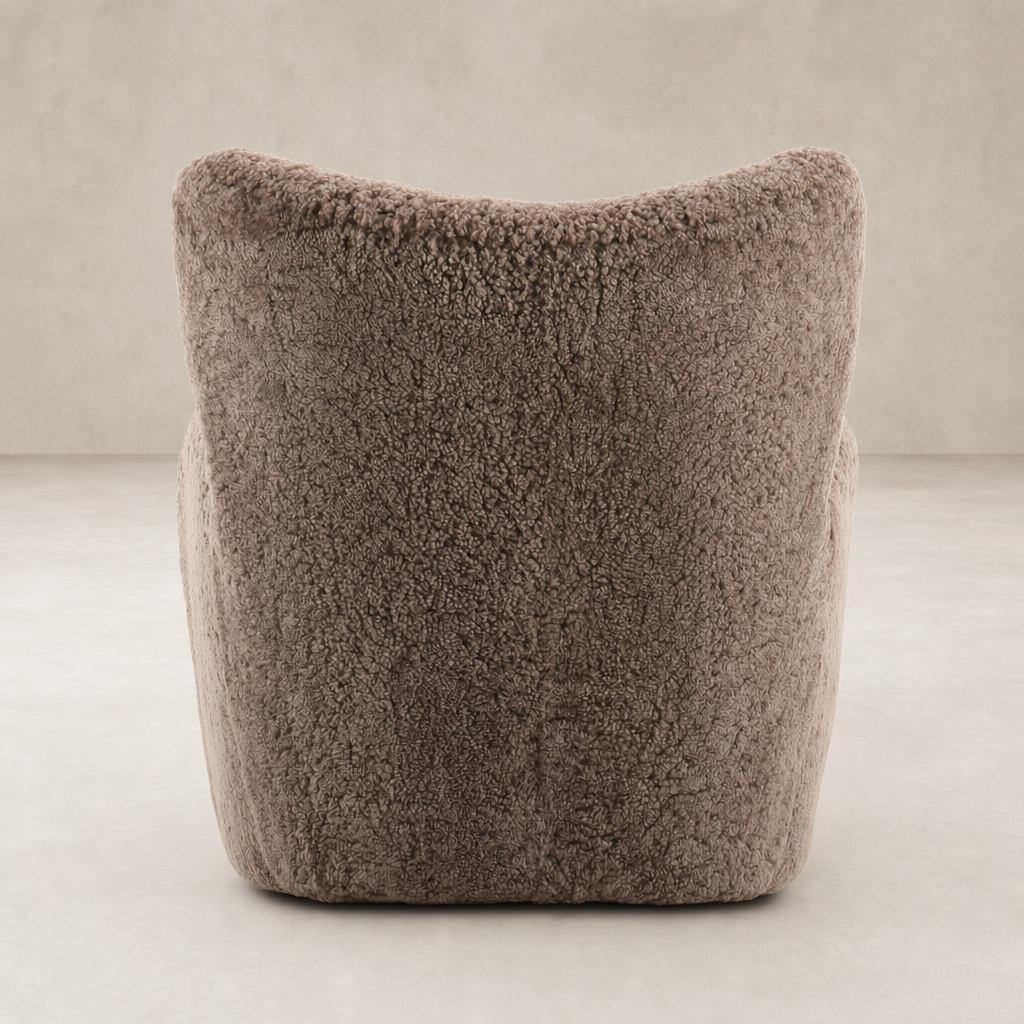 Elodie Chair in taupe shearling showcasing soft, textured upholstery and cozy silhouette.