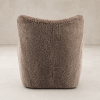 Elodie Chair in taupe shearling showcasing soft, textured upholstery and cozy silhouette.