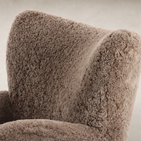 Elodie Chair in taupe shearling featuring a soft, textured high-back design.
