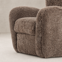 Taupe shearling Elodie Chair with rounded arms and soft, textured upholstery.