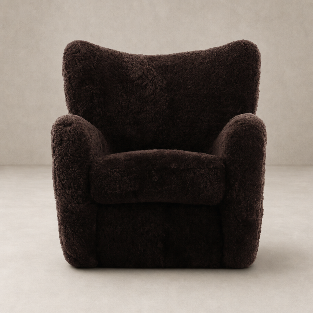 Elodie Chair in cocoa shearling with plush, rounded contours for added comfort.