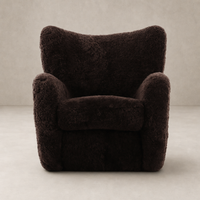 Elodie Chair in cocoa shearling with plush, rounded contours for added comfort.