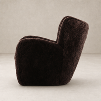 Elodie Chair in cocoa shearling with a soft, rounded silhouette and plush texture.