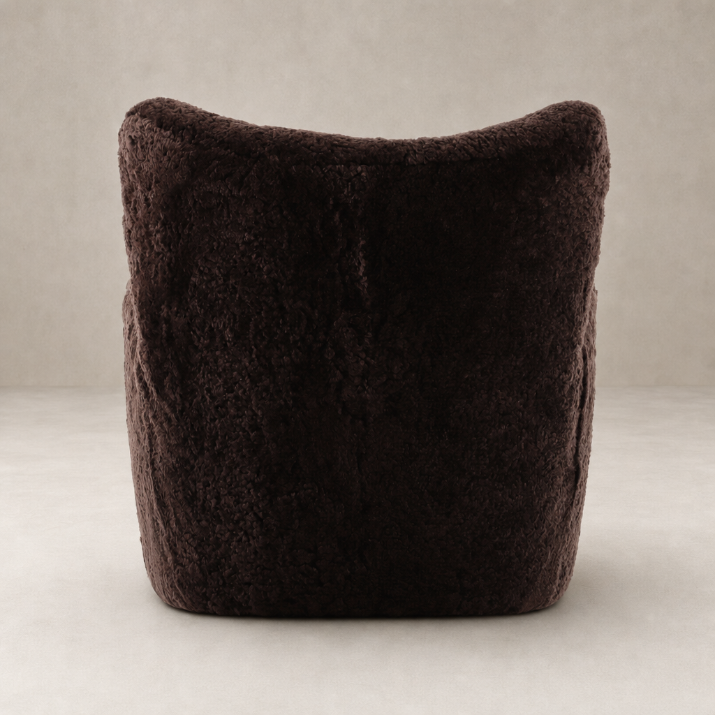 Elodie Chair in cocoa shearling featuring a plush, rounded back design.