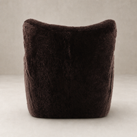 Elodie Chair in cocoa shearling featuring a plush, rounded back design.