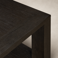Close-up of the Otis End Table featuring a dark wood finish and textured surface.