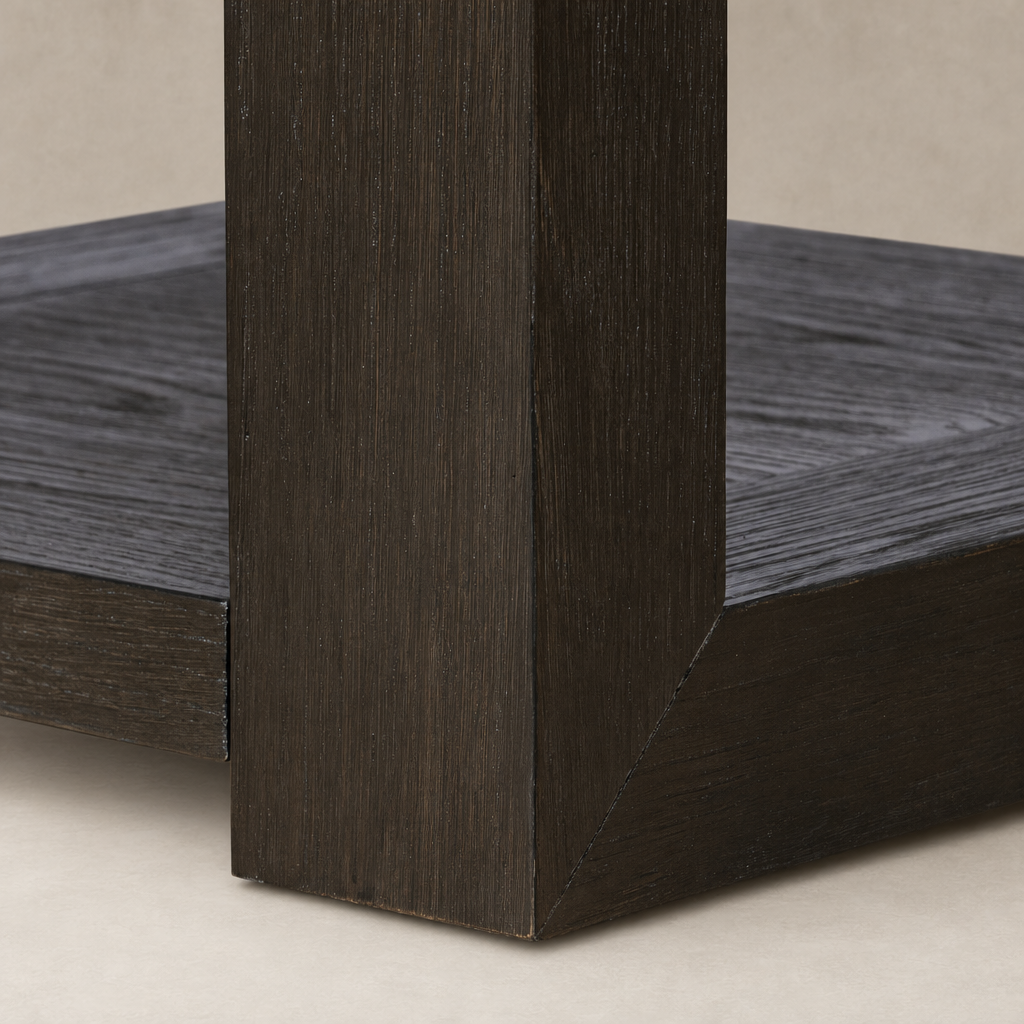 Close-up of Otis End Table showcasing its dark wood finish and angular design.
