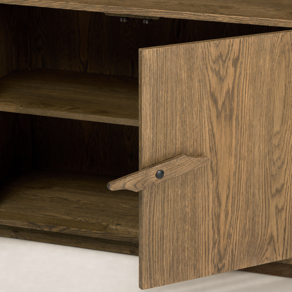 Odessa Bookcase featuring warm natural oak finish and a sleek wooden door handle.