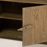 Odessa Bookcase featuring warm natural oak finish and a sleek wooden door handle.