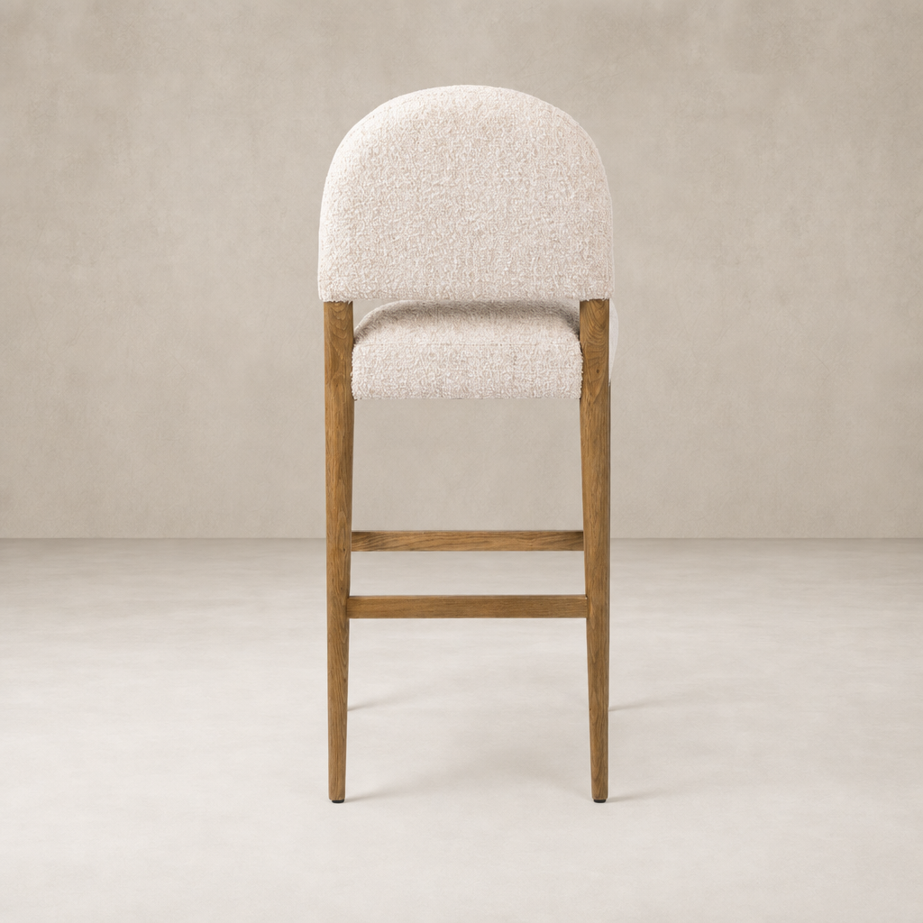 Corinne Bar + Counter Stool in Somerton Ash with a rounded tufted seat design.
